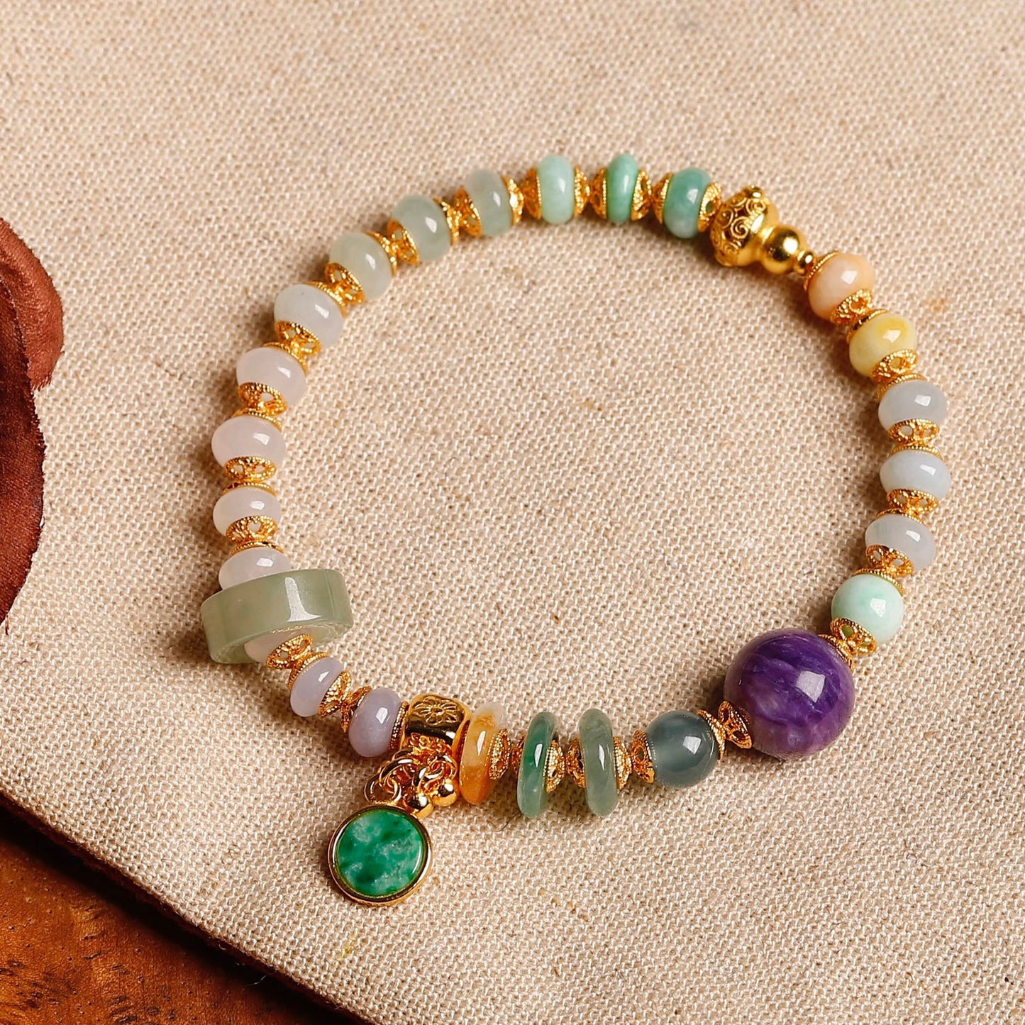 Tri-color jadeite abacus bead bracelet with purple charoite centerpiece, vivid green jade peace pendant and 18K gold-plated S925 silver peace gourd charm