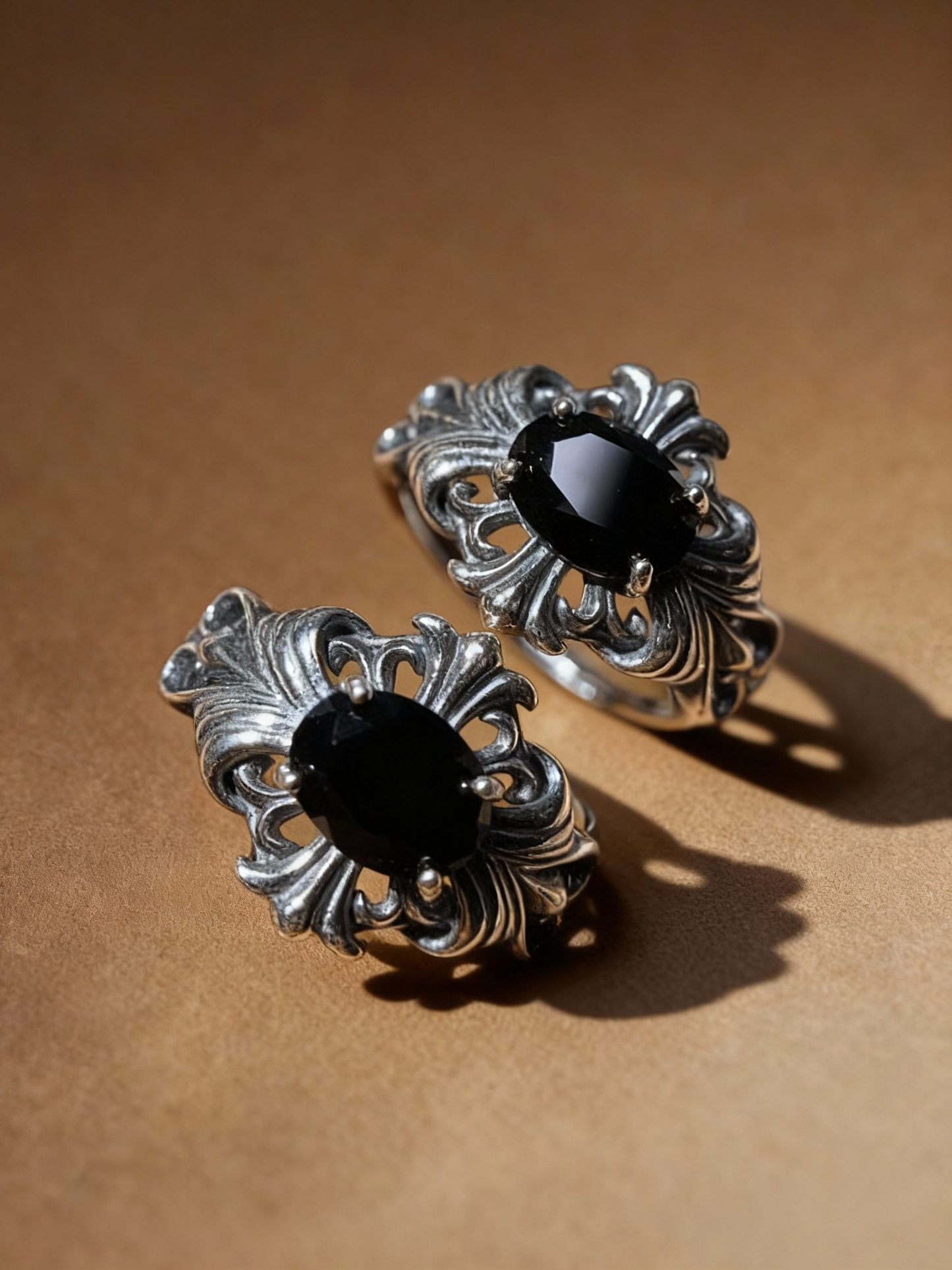 Black spinel ring with classic oval-cut gemstone and silver band