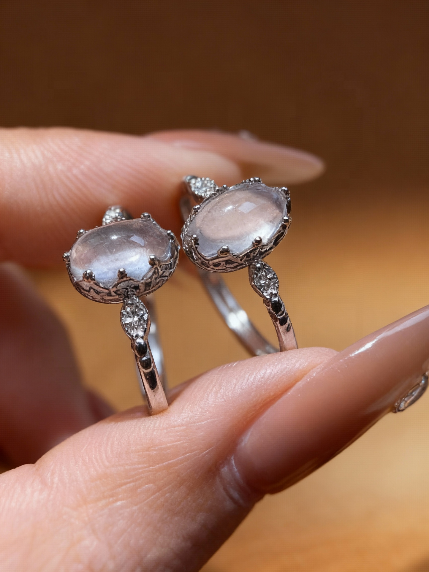 Delicate rose quartz ring showing S925 silver band design