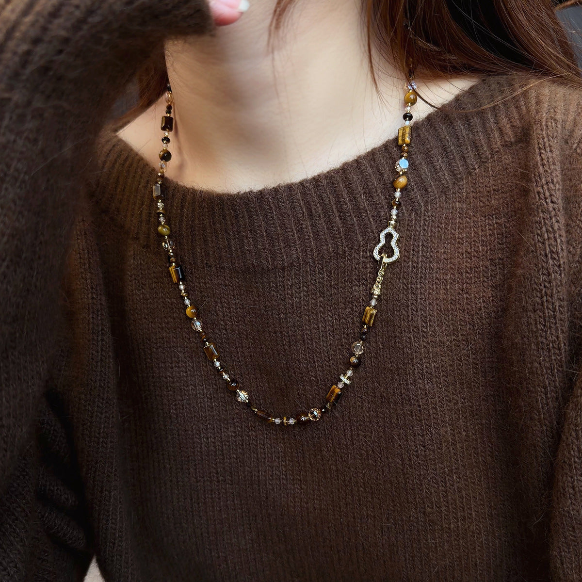 Tiger eye and zircon gourd sweater chain showing traditional design