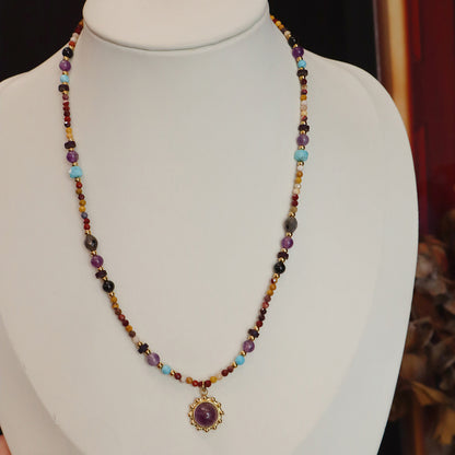 Mixed stone necklace showing purple and golden crystal beads