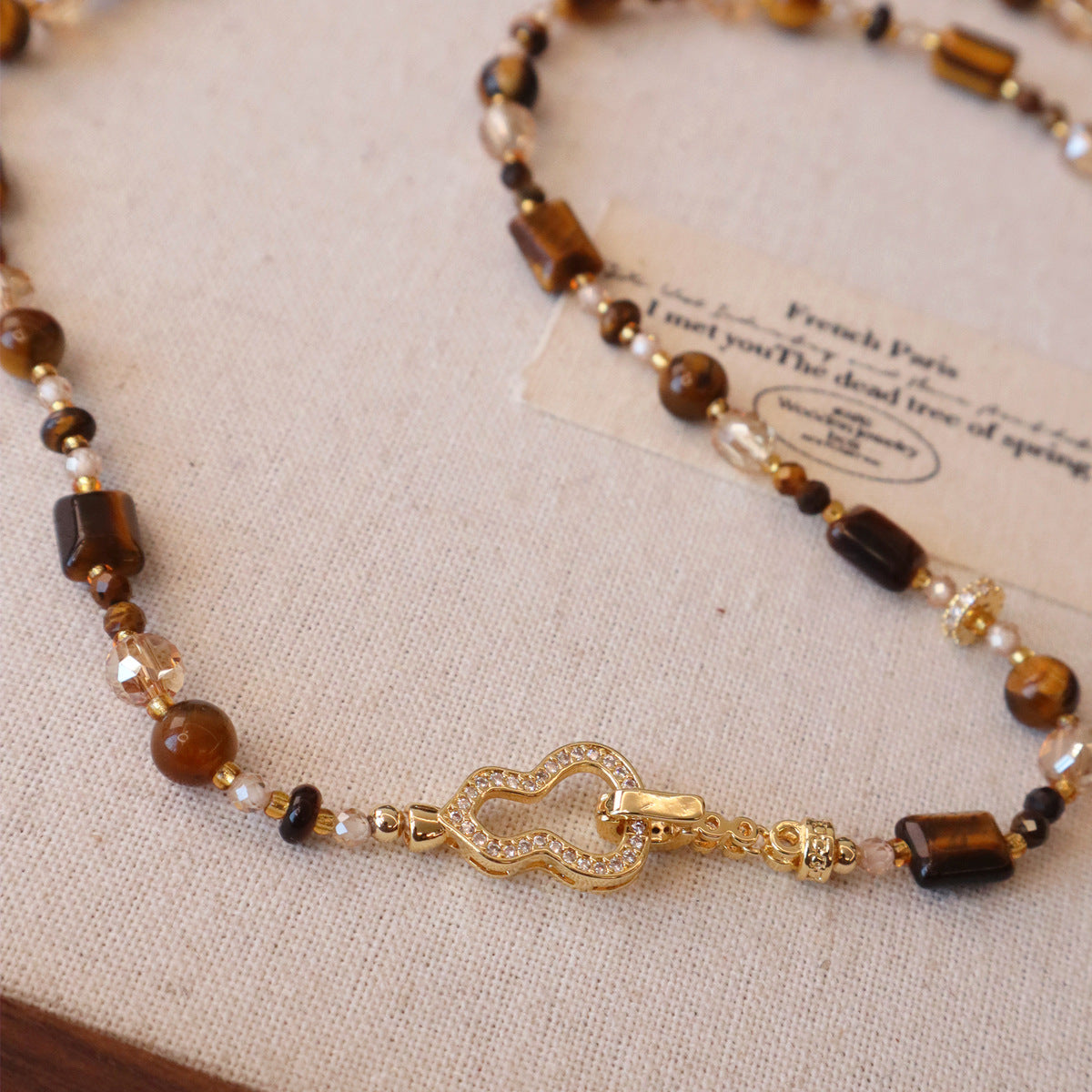 Natural tiger eye sweater chain showing chatoyant bead effect