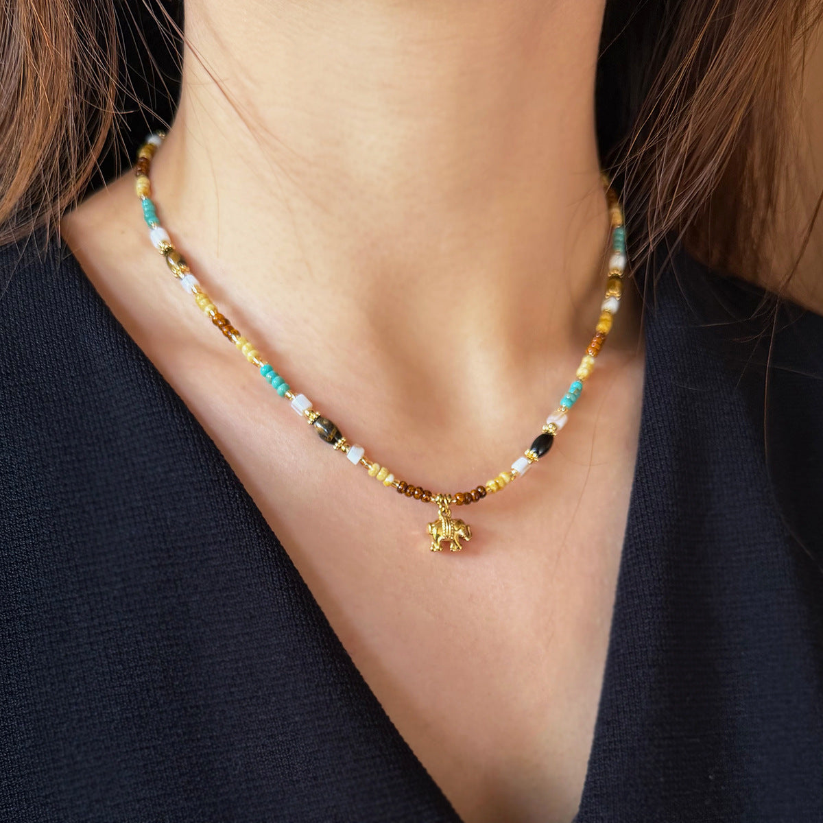 Mixed gemstone beaded necklace with decorative elephant pendant