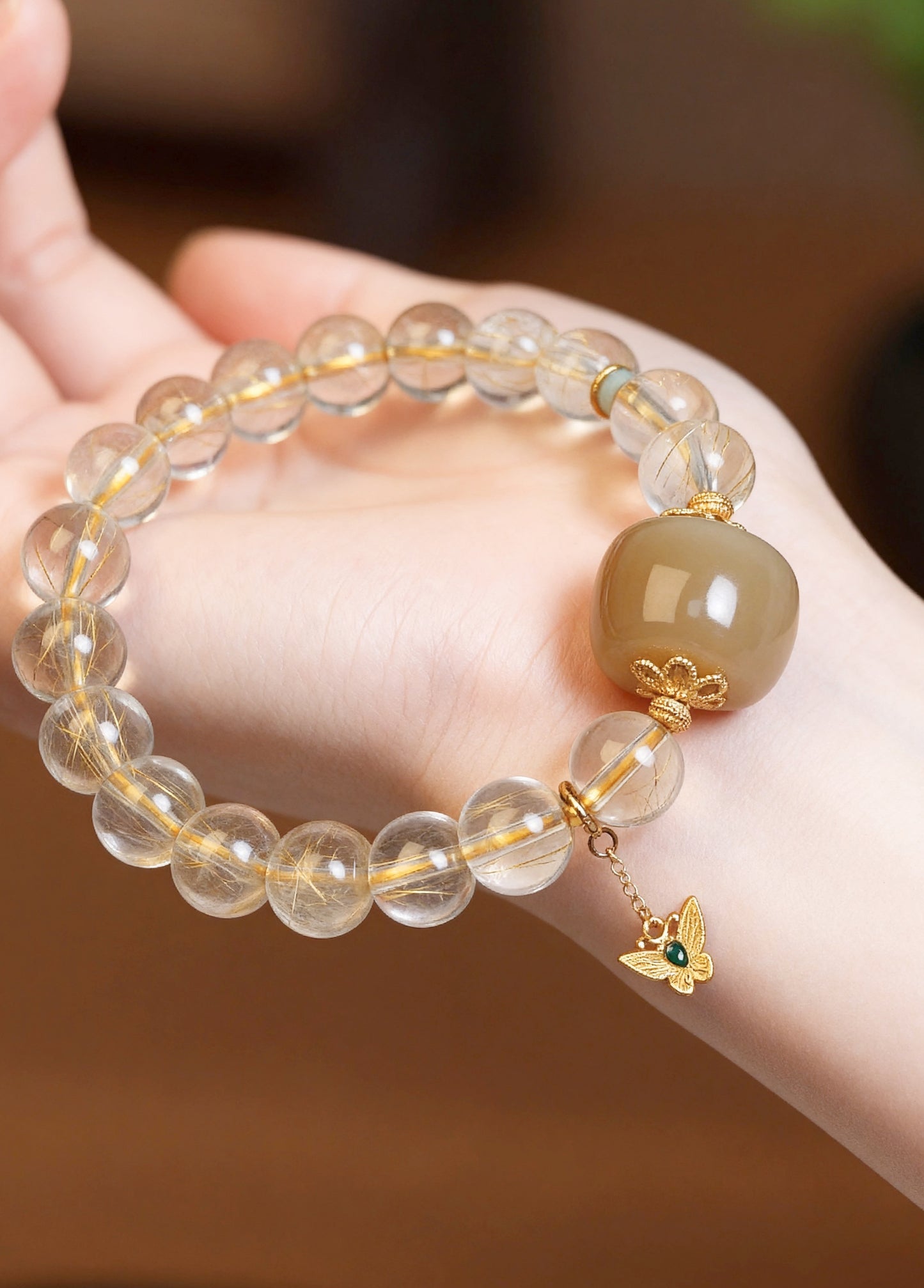 Close-up of clear quartz beads with sugar jade accents