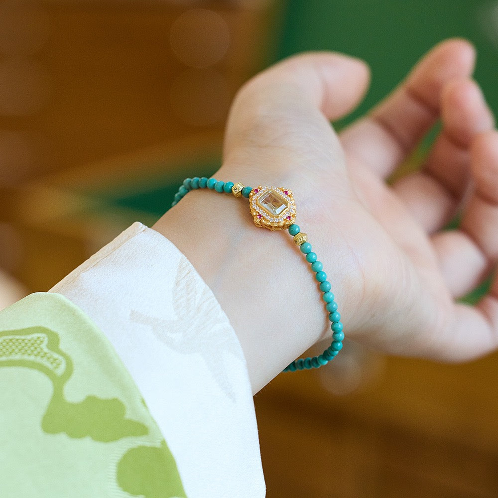 Detail of natural turquoise and pearl beaded bracelet