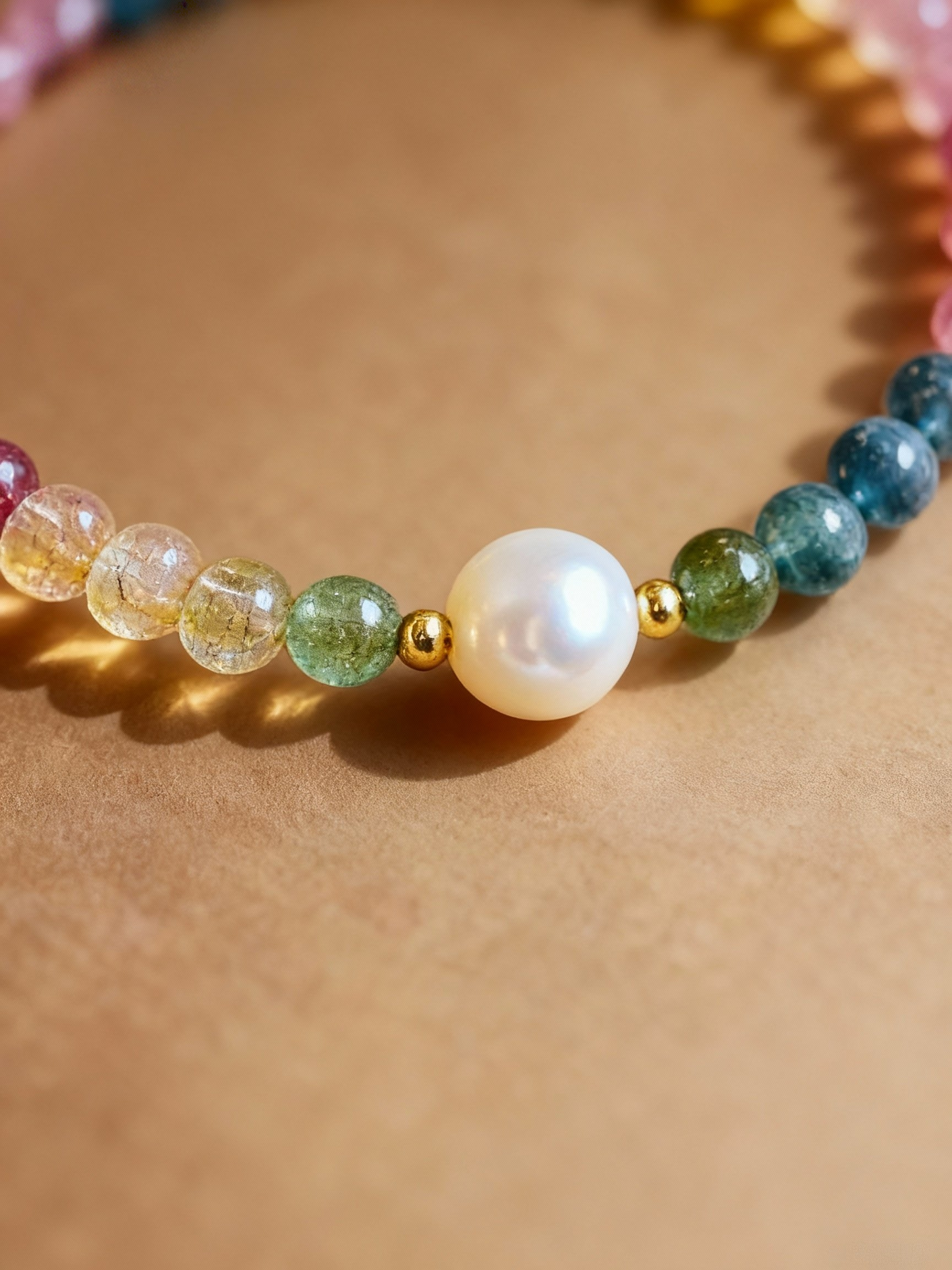 Detail of multi-colored tourmaline and pearl beaded bracelet