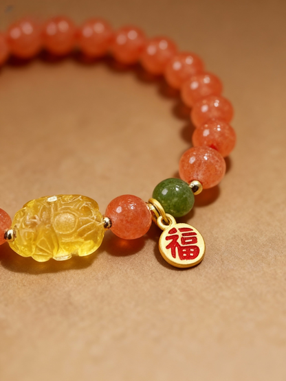 Natural red agate crystal bracelet showing cherry-red color