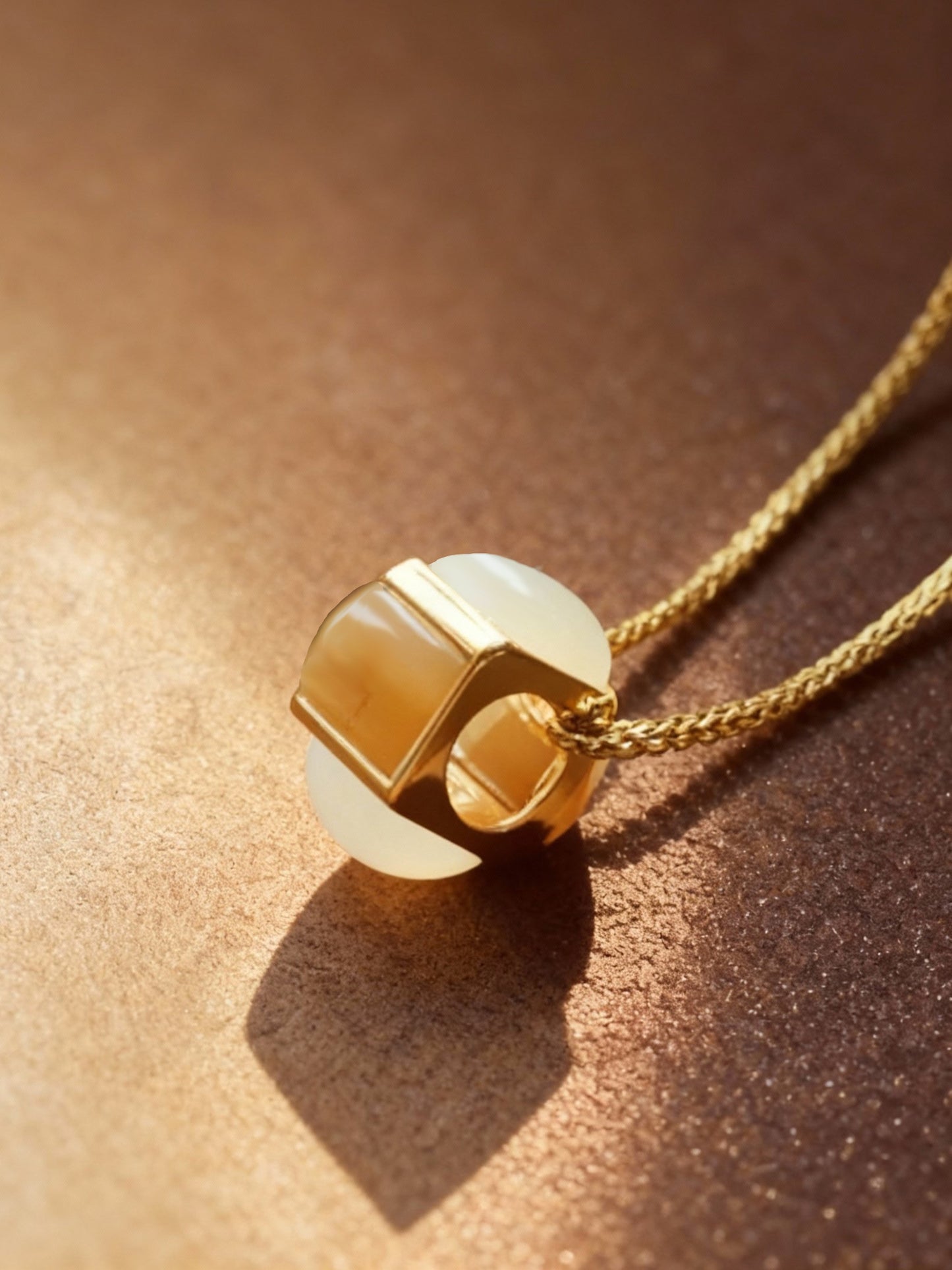 Close-up of bicolor jade earrings showing two-tone green colors