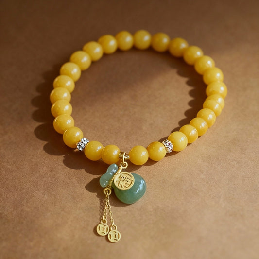 Natural amber bracelet with Hetian jade fortune pouch charm
