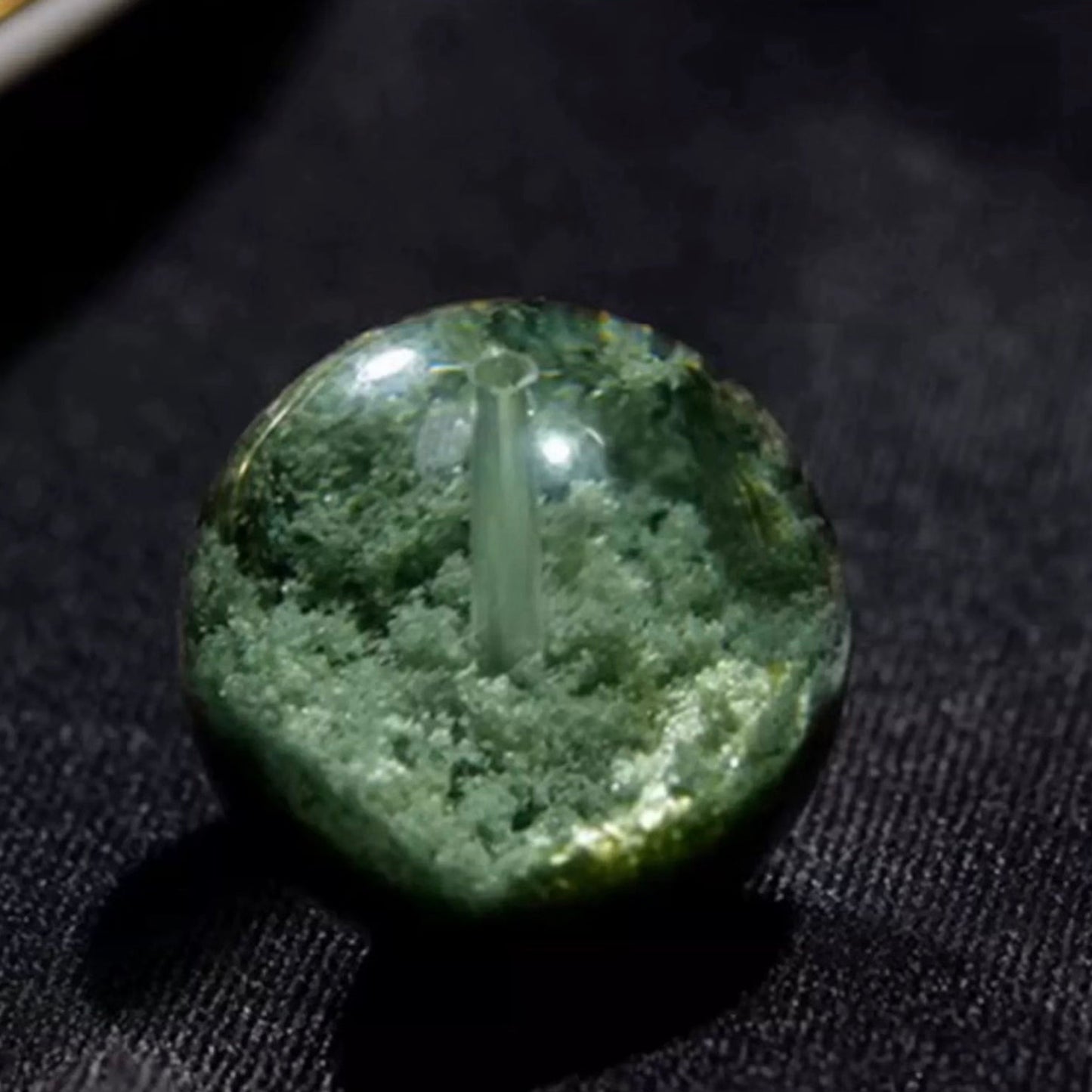 Grade green phantom quartz bracelet with visible mineral inclusions