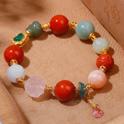 Natural green jadeite Pixiu charm with 24K gold-plated setting on handcrafted gemstone bracelet
