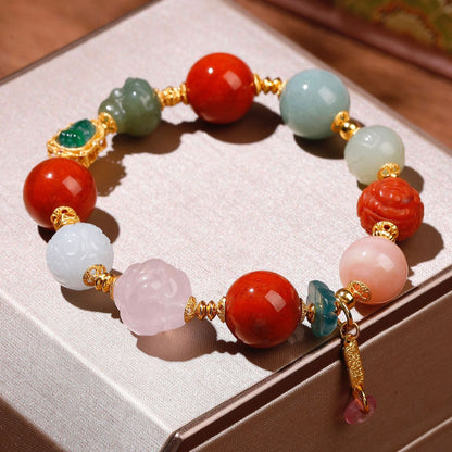 Natural rose quartz phoenix carving and white Hetian jade bead detail on lucky gemstone bracelet