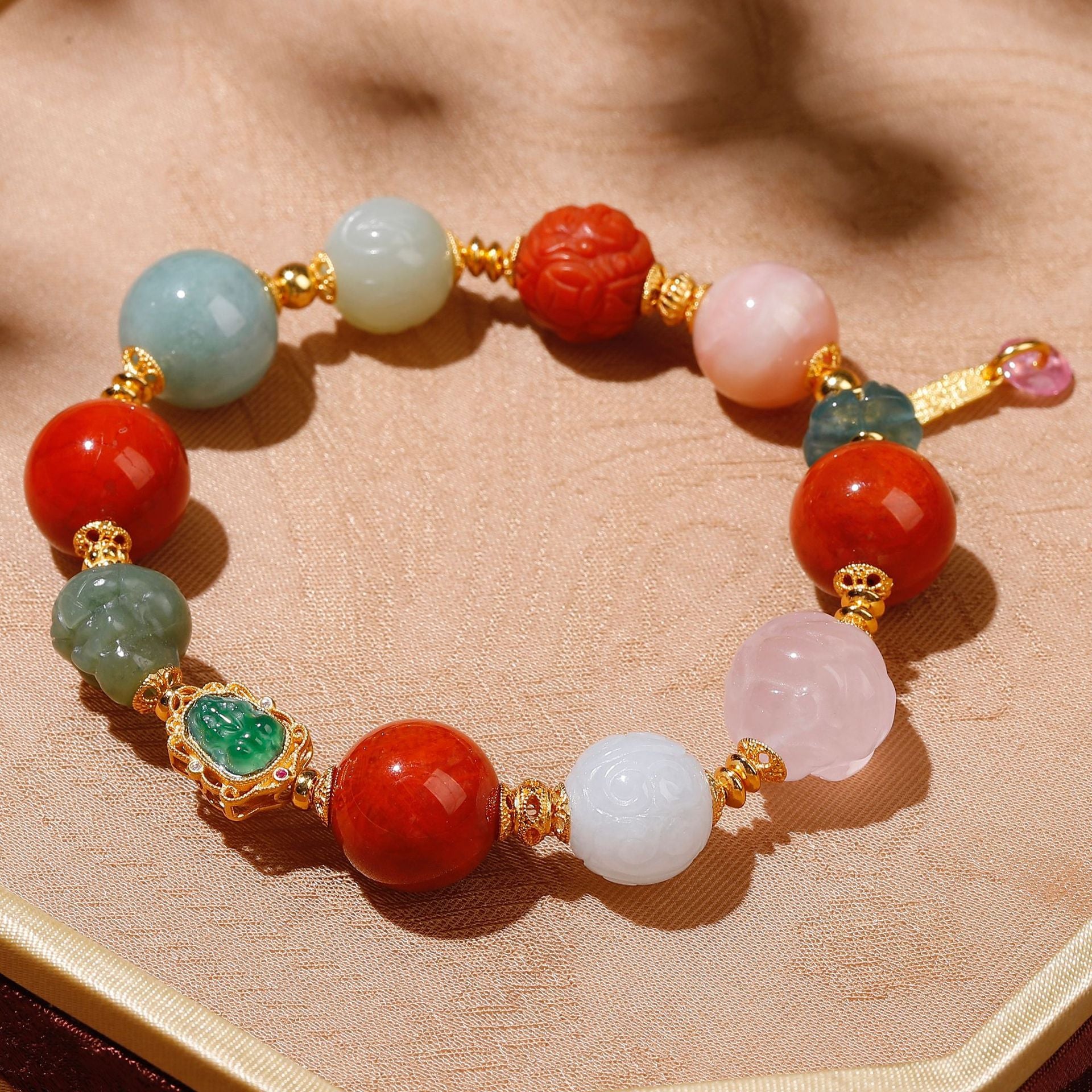Natural rose quartz phoenix carving and white Hetian jade bead detail on lucky gemstone bracelet