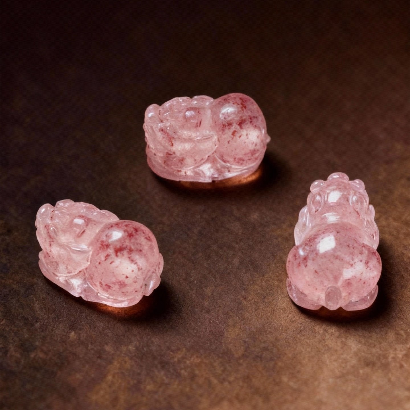 Tourmaline Pixiu ring showing colorful stones and strawberry quartz beads