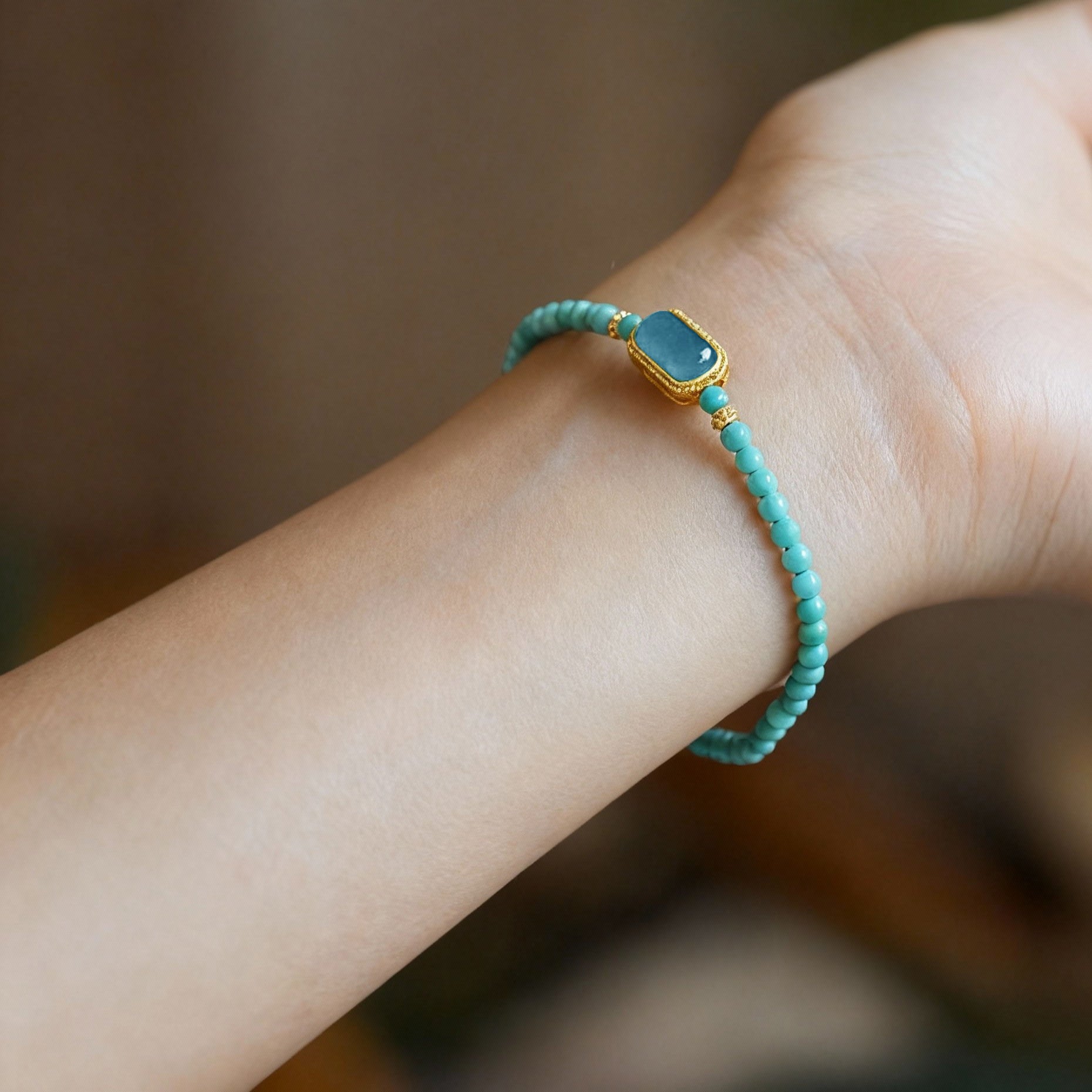 Close-up of turquoise and blue jade beaded bracelet