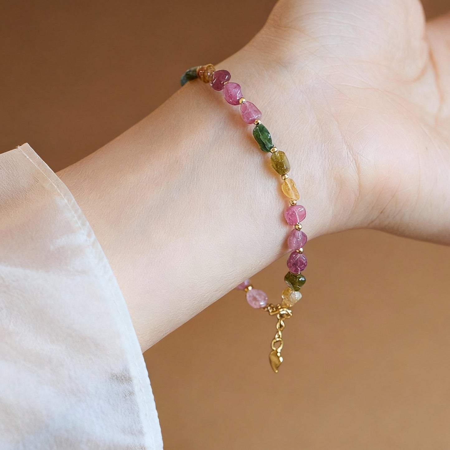 Close-up of raw tourmaline beads showing rainbow candy colors