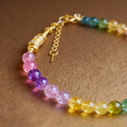Detail of multi-colored tourmaline bracelet with gold-plated bead