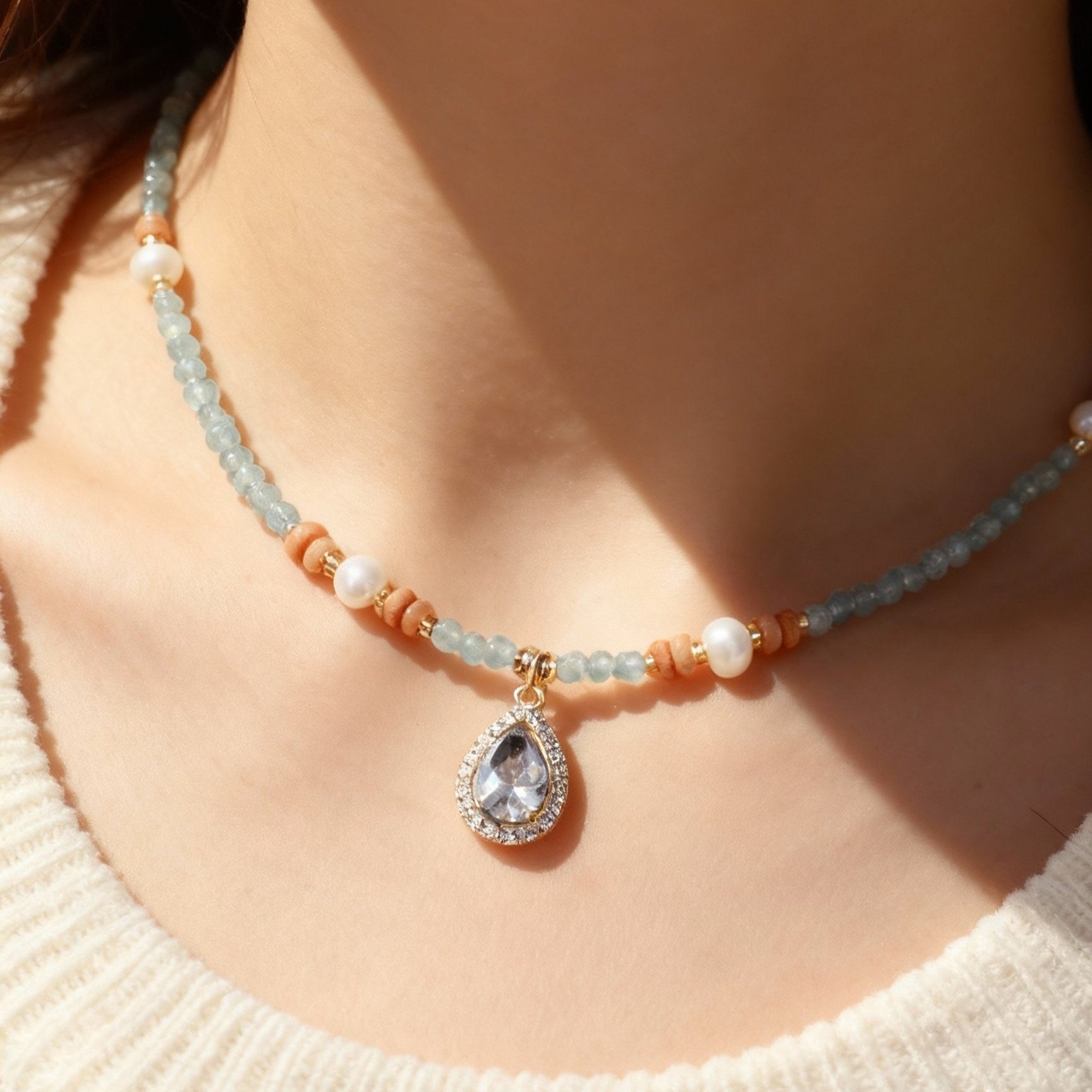 Natural aquamarine necklace showing blue heart pendant and pearls