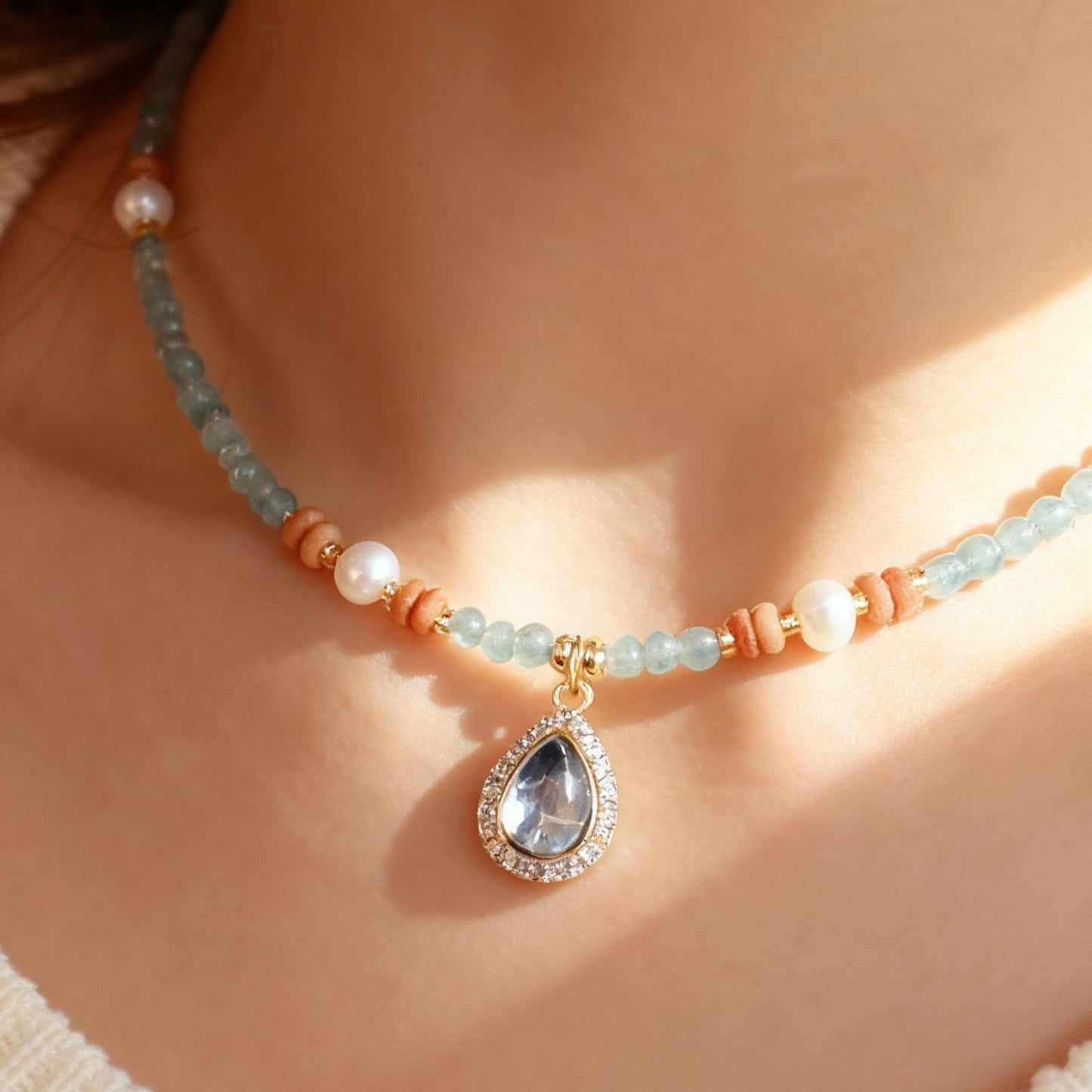 Blue aquamarine ocean heart pendant with crystal beads