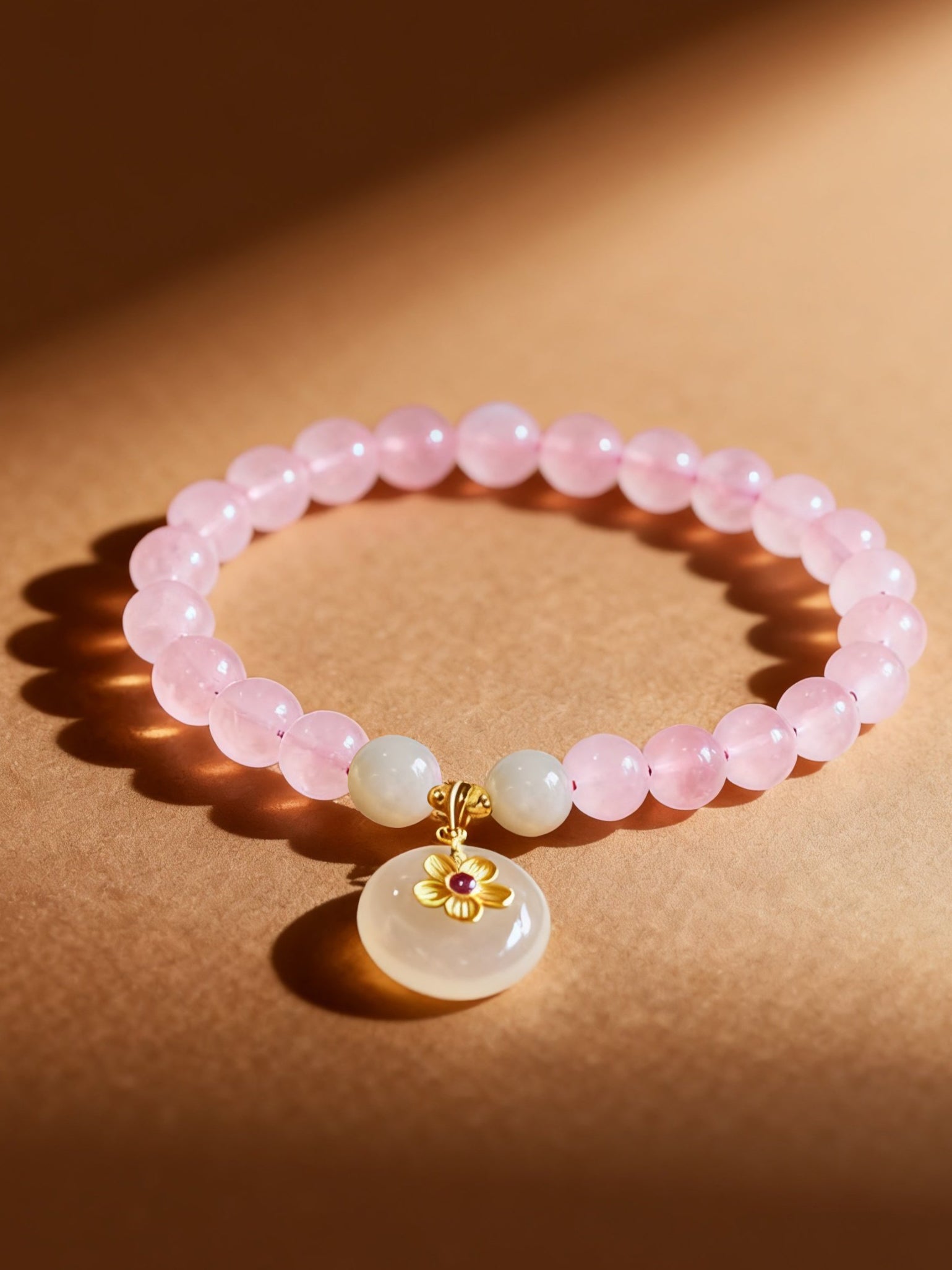 Pink crystal and white jade beaded bracelet showing natural colors