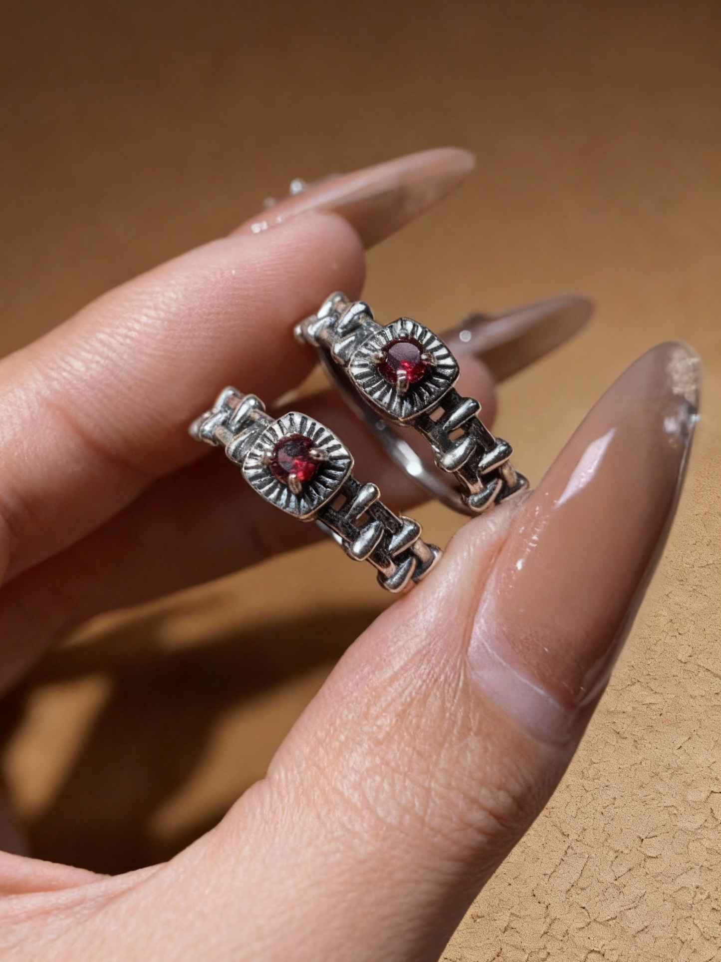 Garnet ring showing chain-link band detail