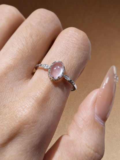 Detail of rose quartz crystal setting on sterling silver ring