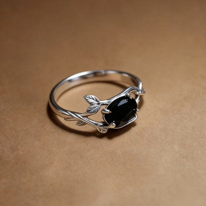 Close-up of black spinel gemstone on twig-style silver ring