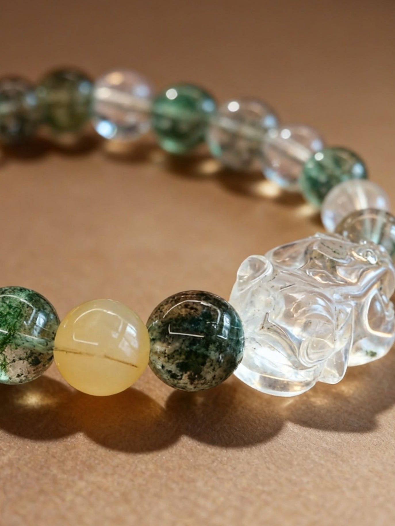 Natural phantom quartz beaded bracelet showing green inclusions