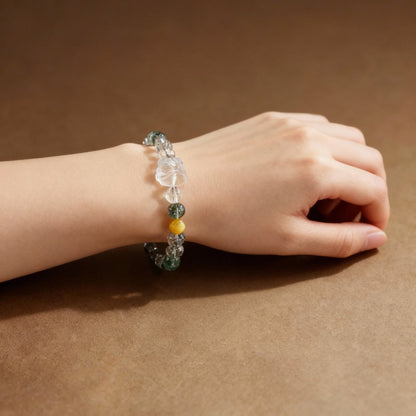 Close-up of green phantom quartz beads with lion dance pendant