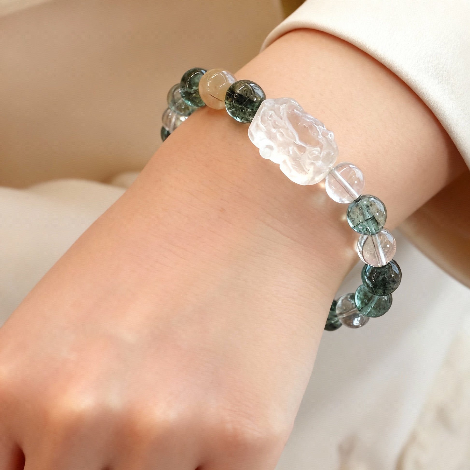 Close-up of green phantom quartz beads with Pixiu pendant