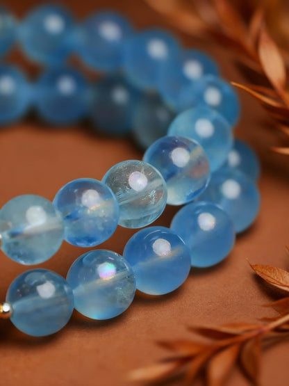 Detail shots of aquamarine and quartz beadwork
