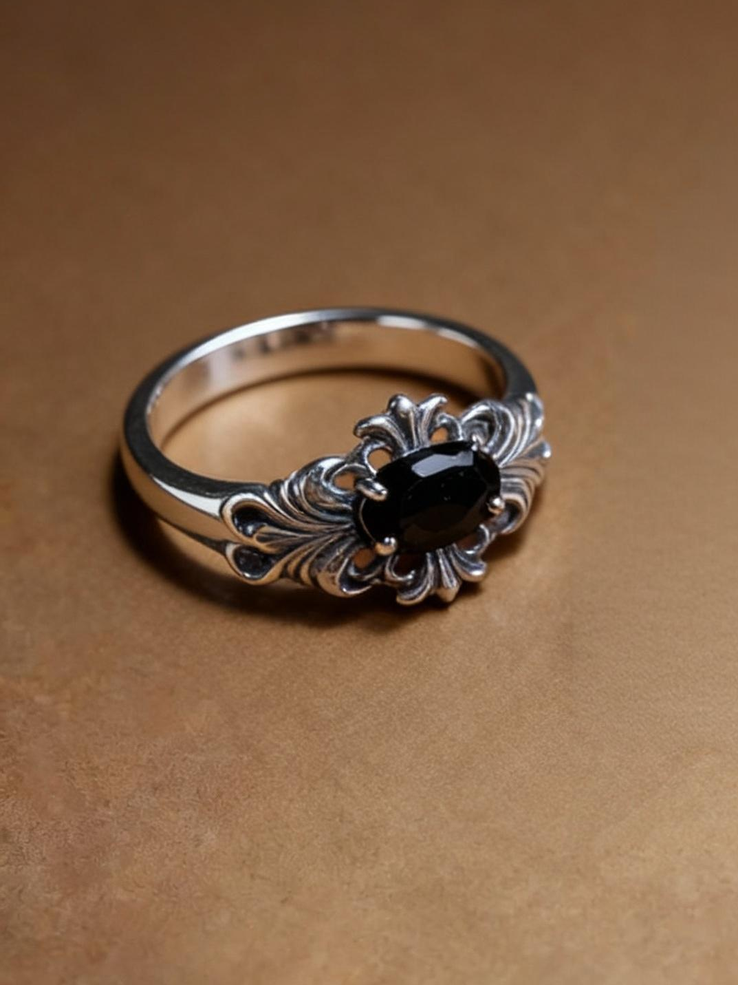 Oval black spinel ring showing S925 silver band design