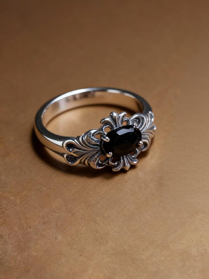 Oval black spinel ring showing S925 silver band design