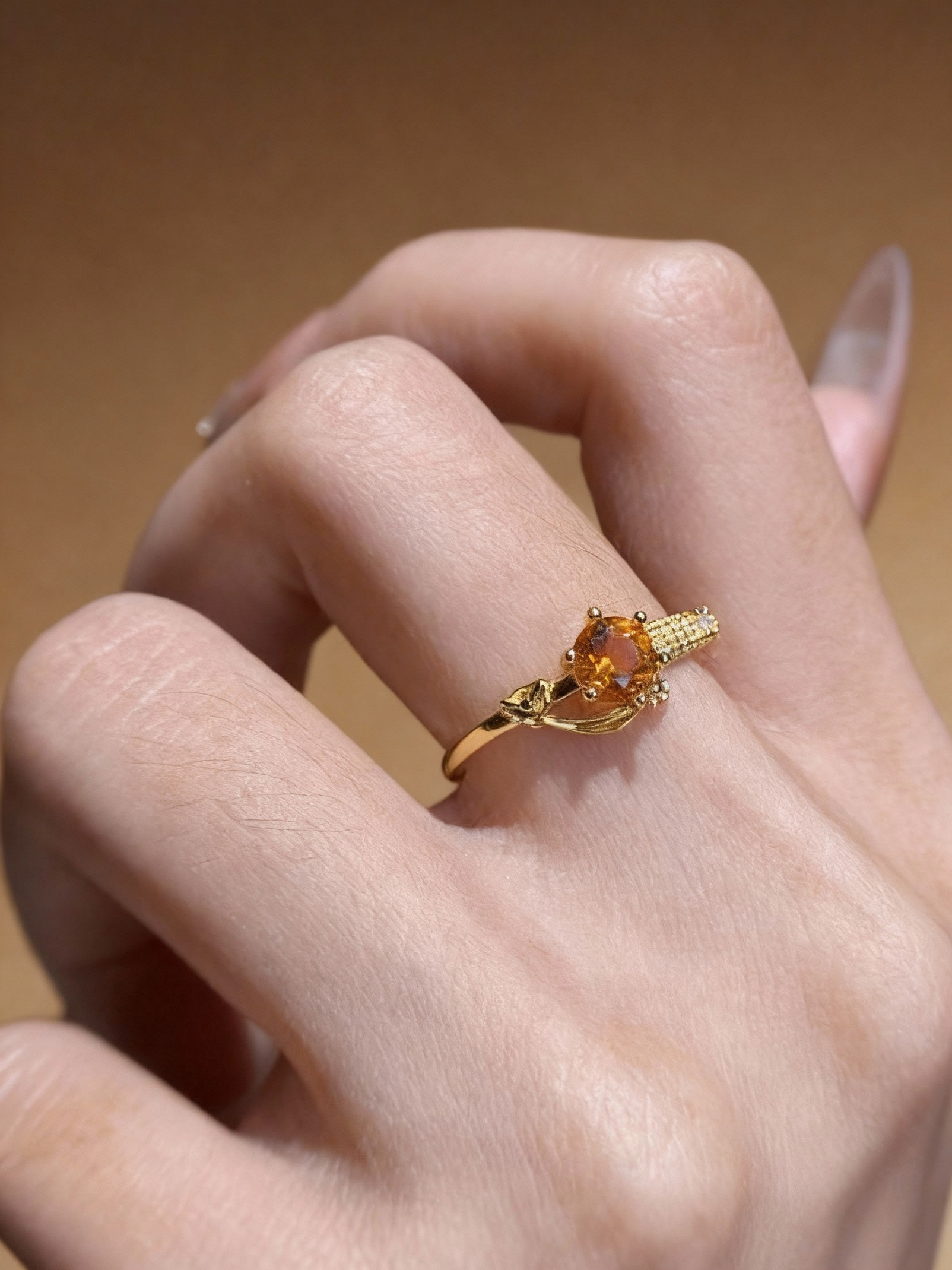 Golden citrine ring with round gemstone and plated band
