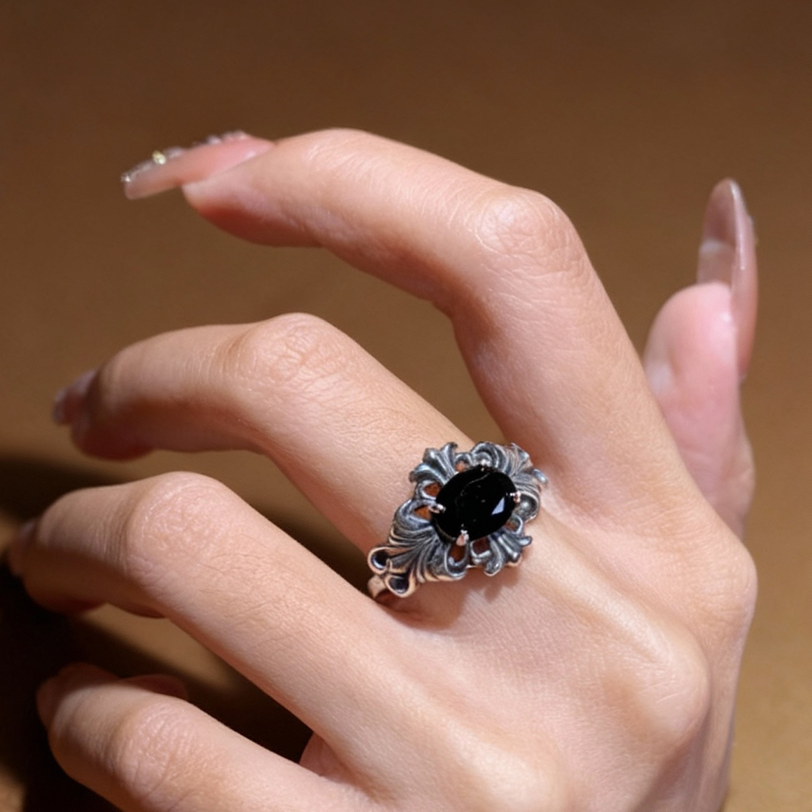 Detail of oval black spinel stone setting on sterling silver ring