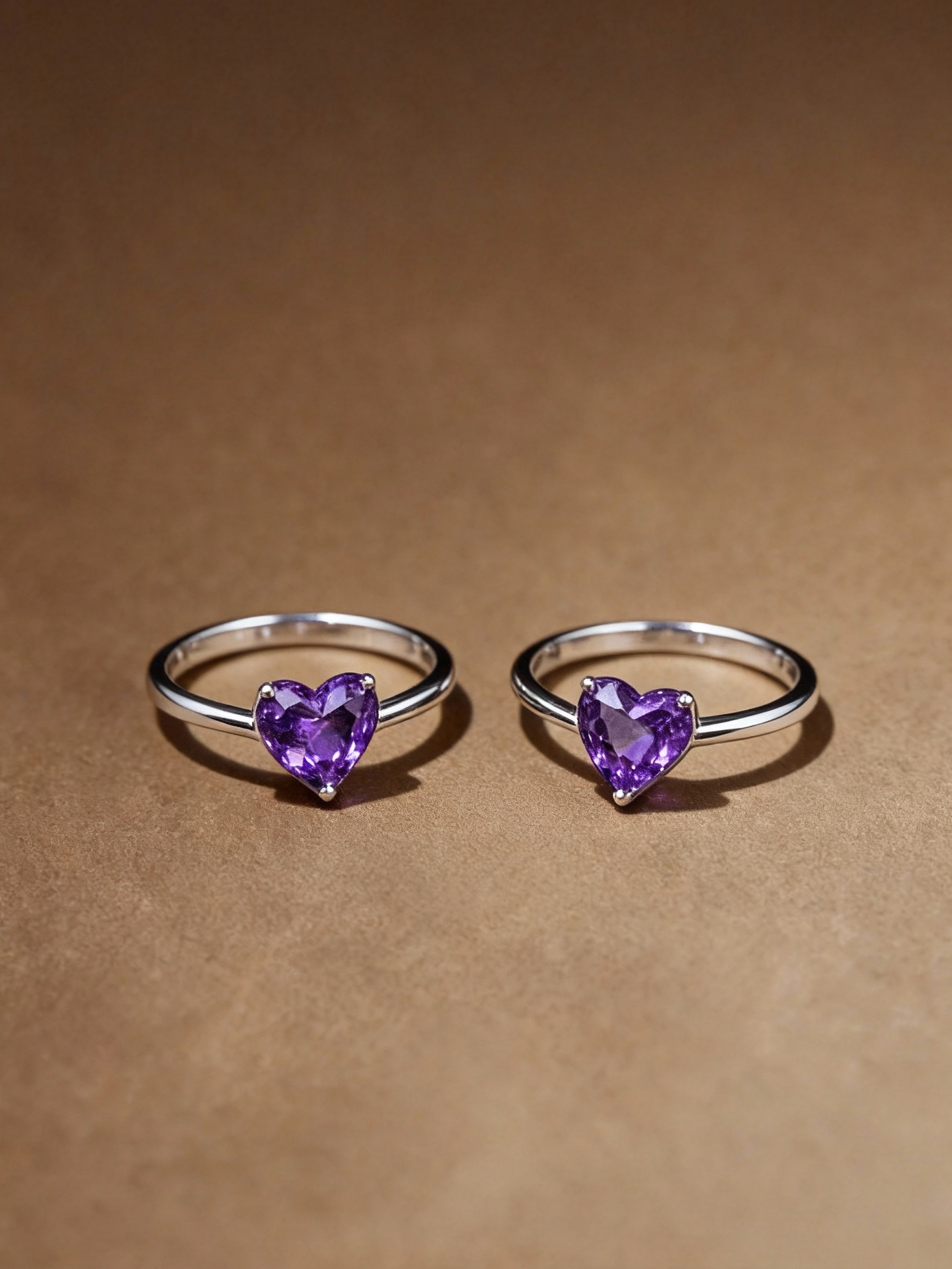 Close-up of heart-shaped amethyst stone on ring