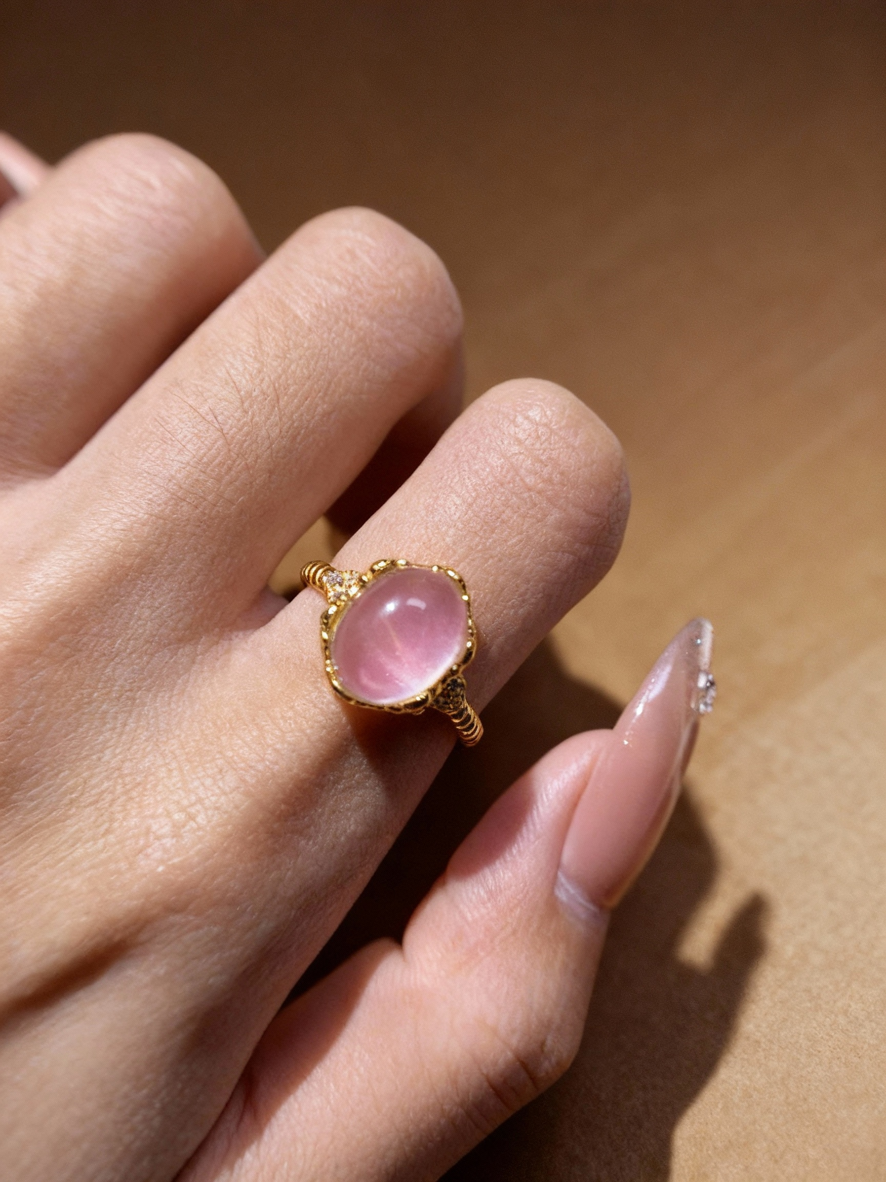 Rose quartz gemstone ring showing natural pink color