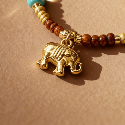 Close-up of elephant pendant with colorful mixed gemstone beads