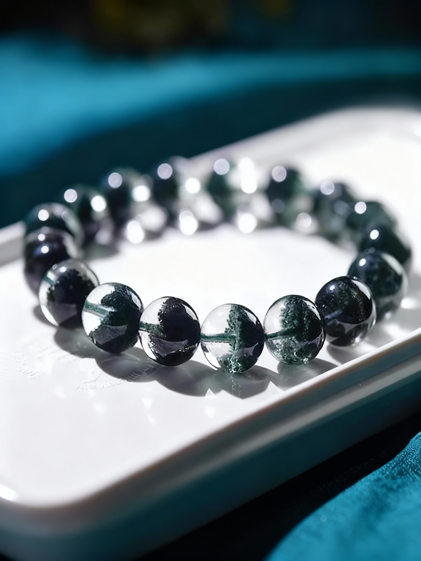 Close-up of green phantom quartz beads with treasure bowl inclusions