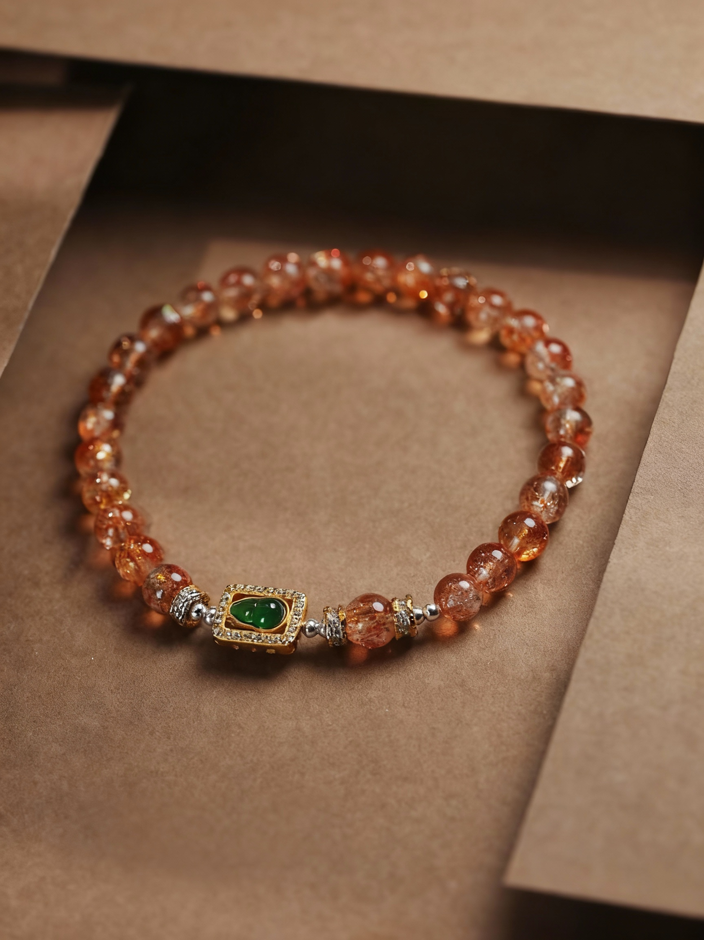 Sunstone and jade gourd bracelet detail shot