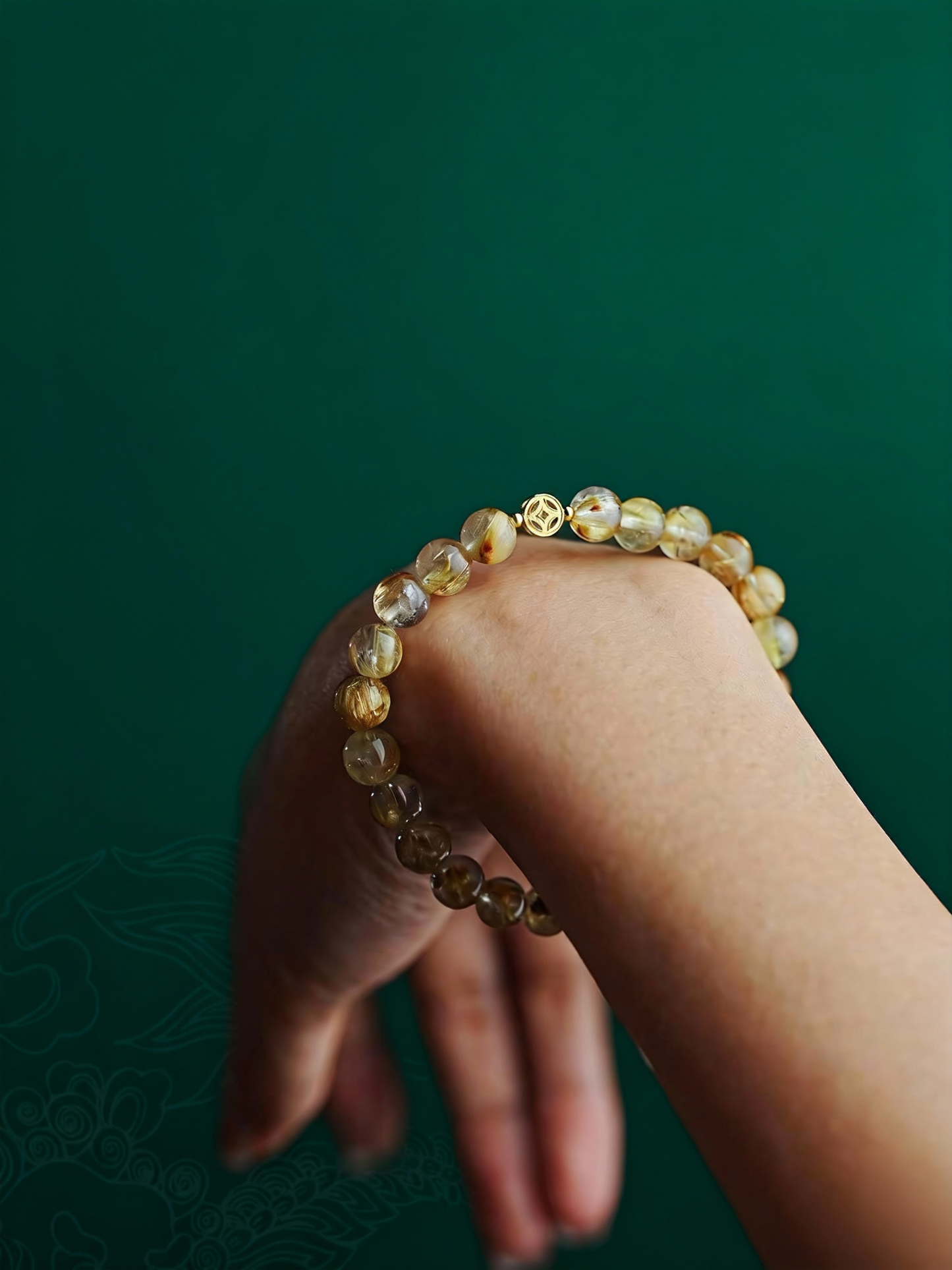 Natural rutilated quartz beaded bracelet with traditional Chinese symbolism