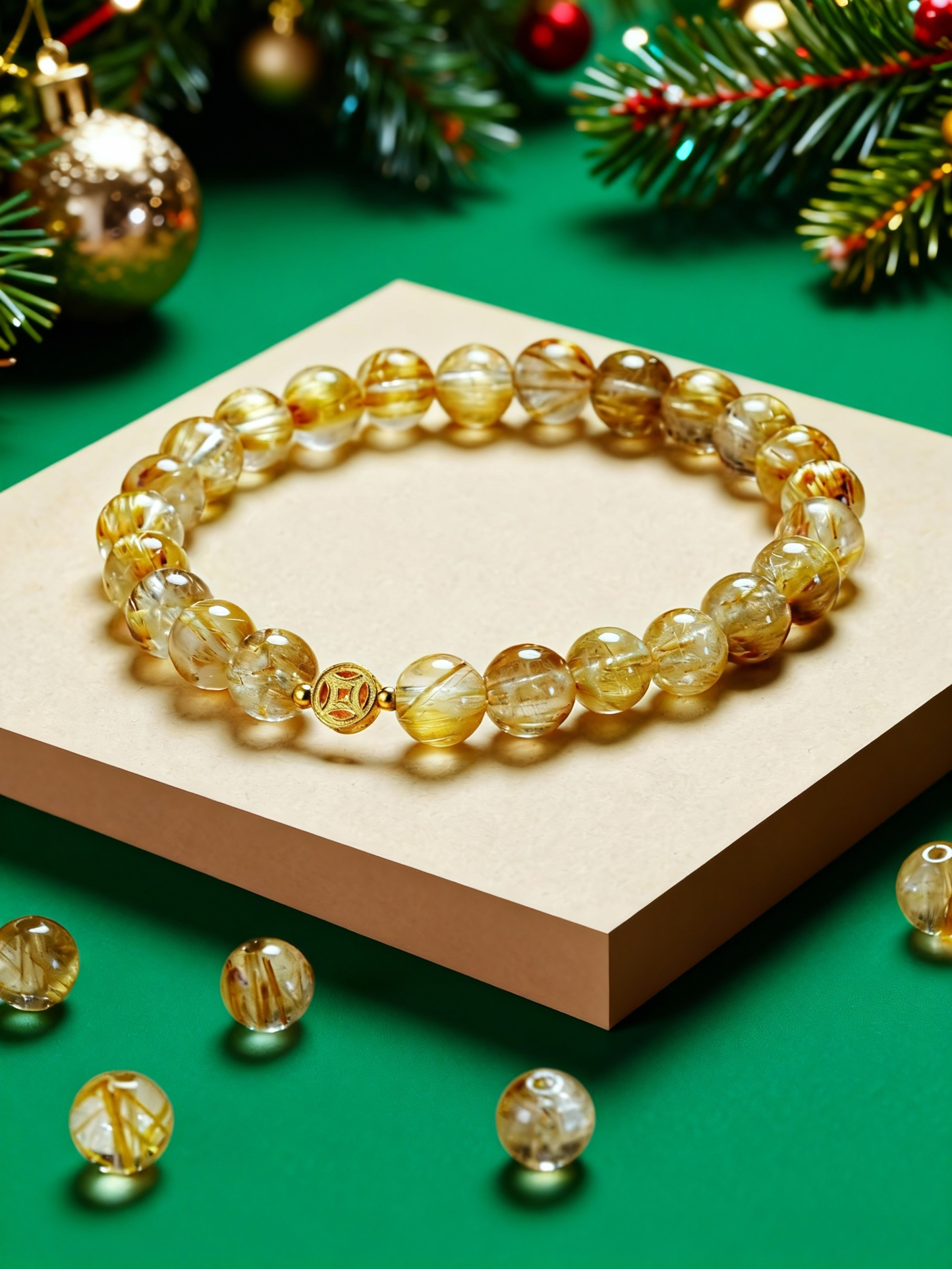 Detail of rutilated quartz bracelet showing Chinese coin charm