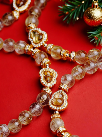 Rutilated quartz crystal bracelet with translucent beads