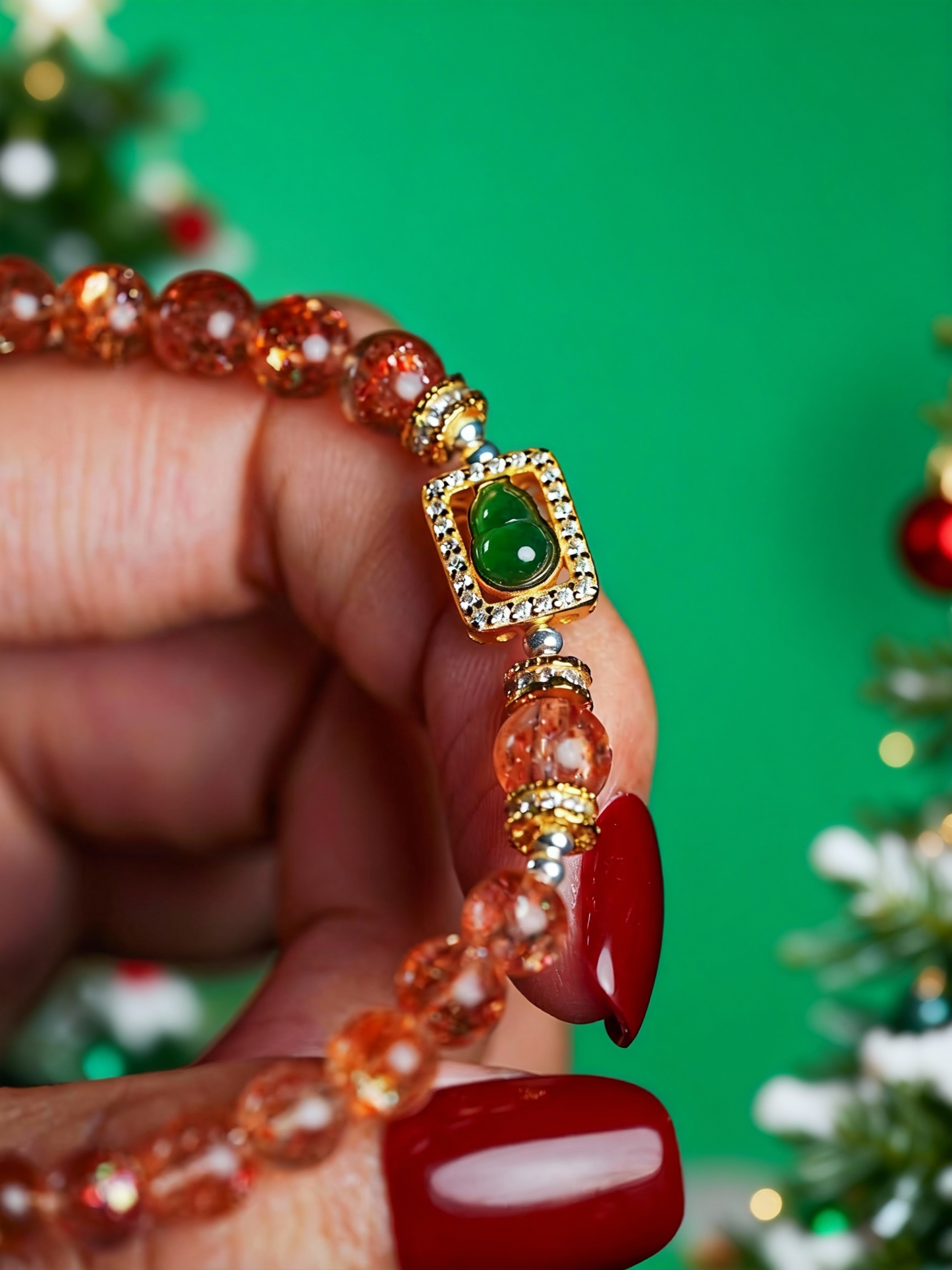 Handcrafted sunstone beaded bracelet with jade gourd charm