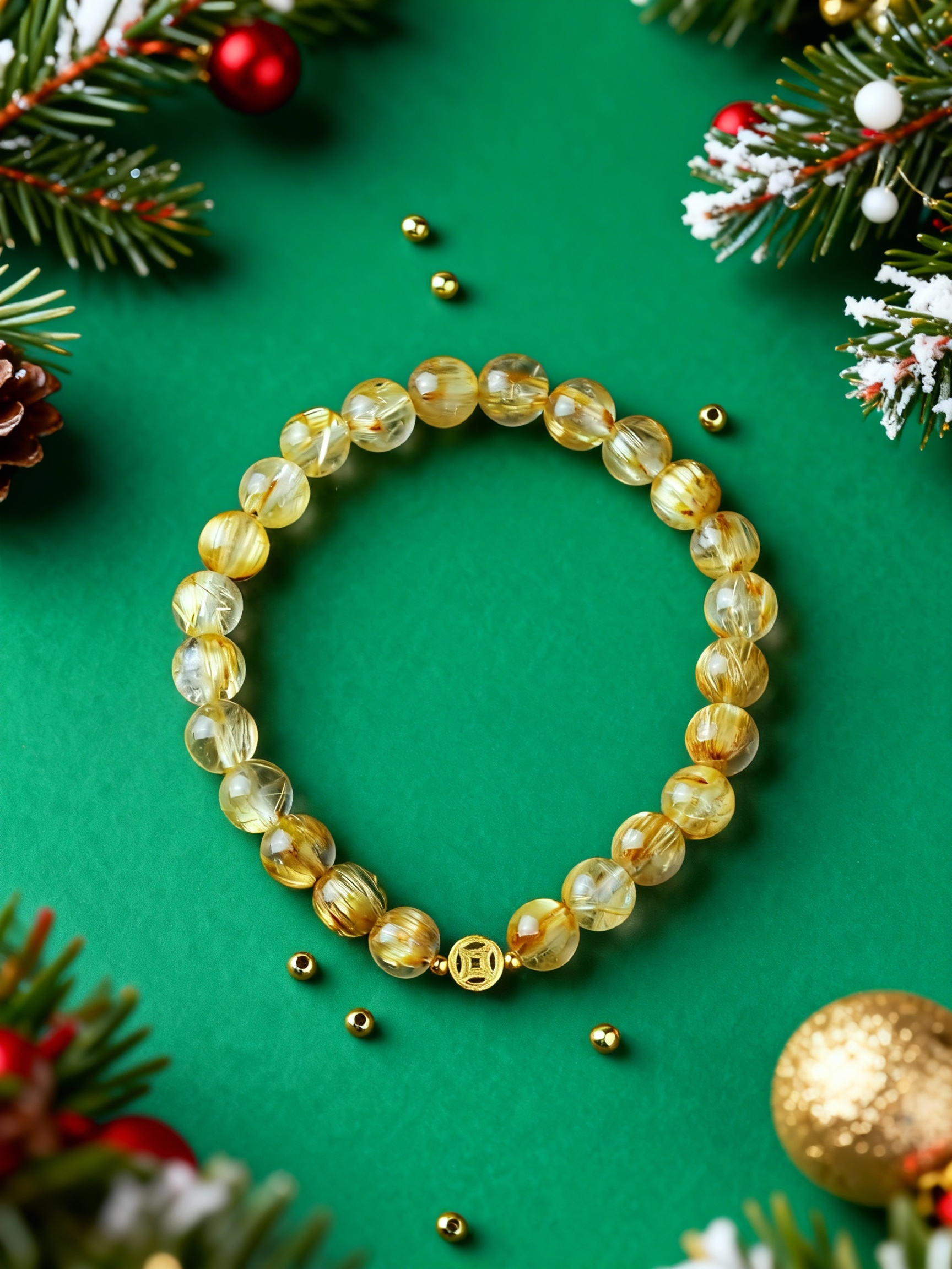 Close-up of golden rutilated quartz beads with needle-like inclusions