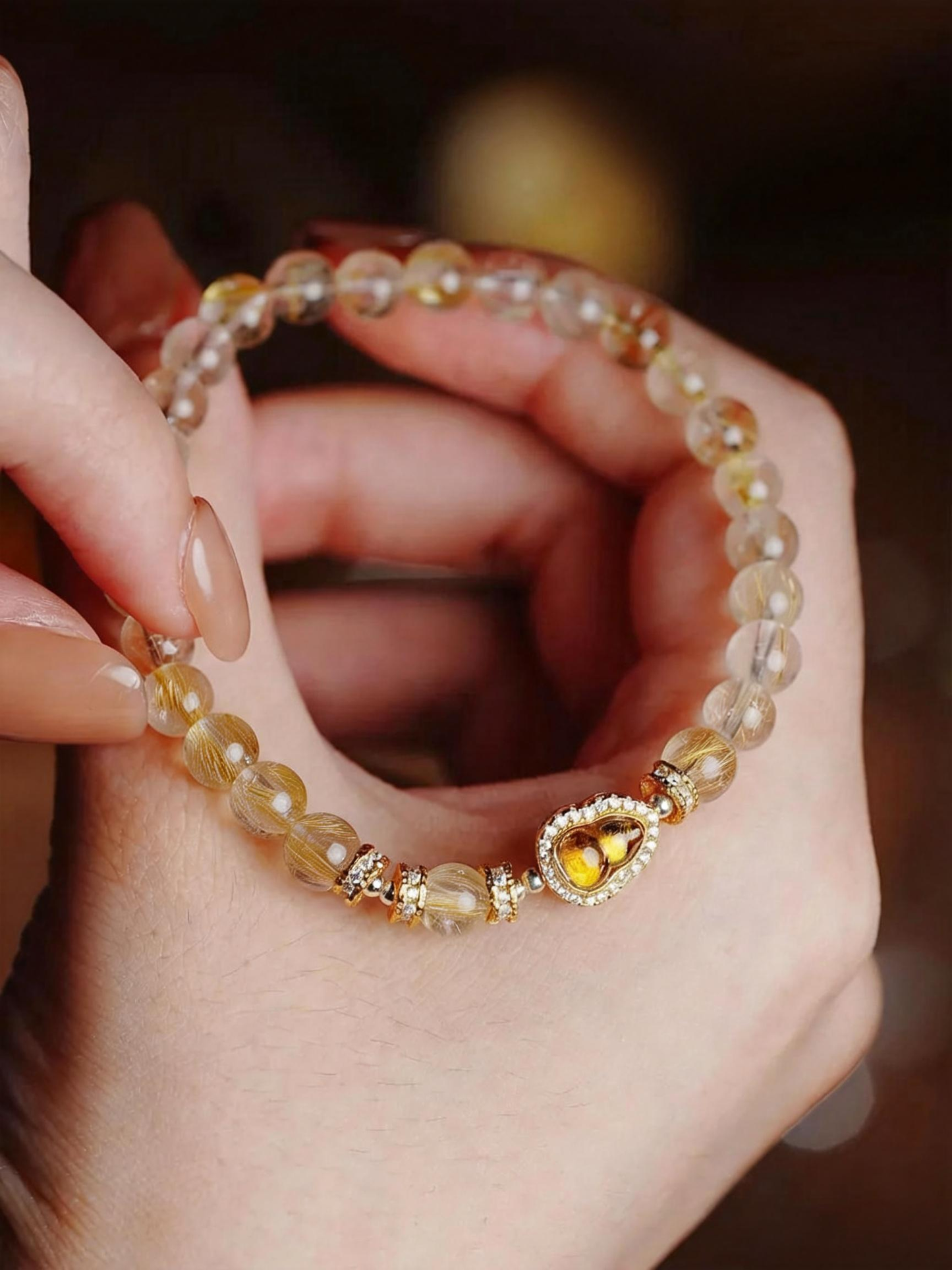 Handcrafted rutilated quartz bracelet showing natural stone quality