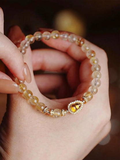 Handcrafted rutilated quartz bracelet showing natural stone quality