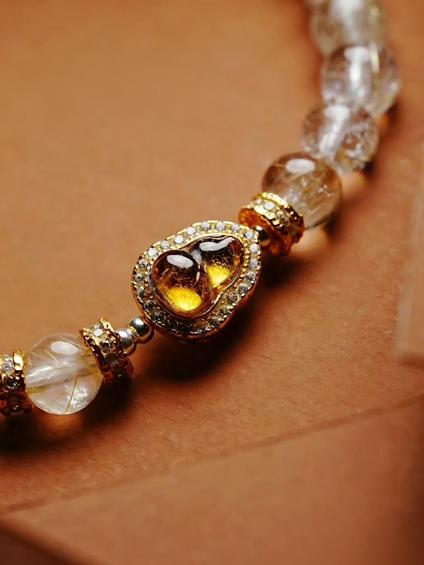 Detail shot of rutilated quartz bead arrangement