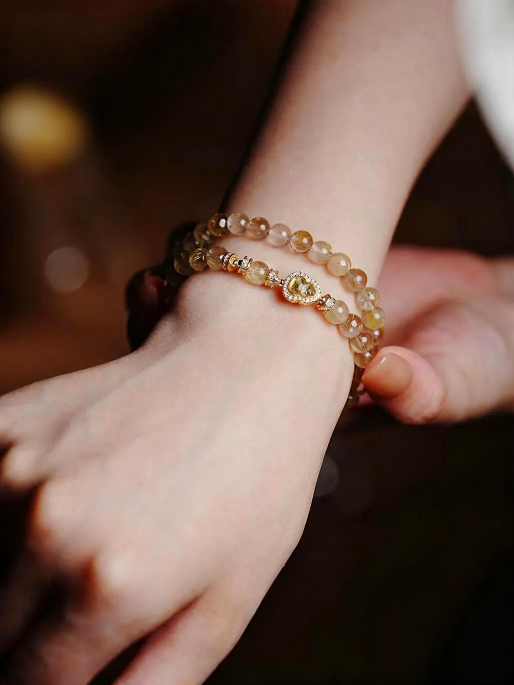 Natural rutilated quartz bracelet with golden needle inclusions