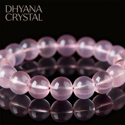 Close-up of ice-clear rose quartz beads showing natural pink color
